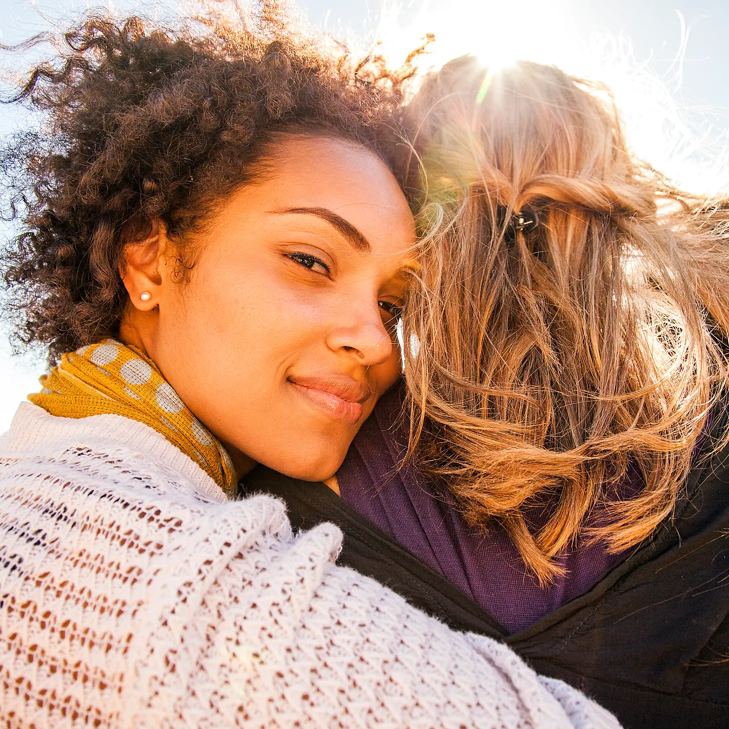A group of young women standing together outdoor