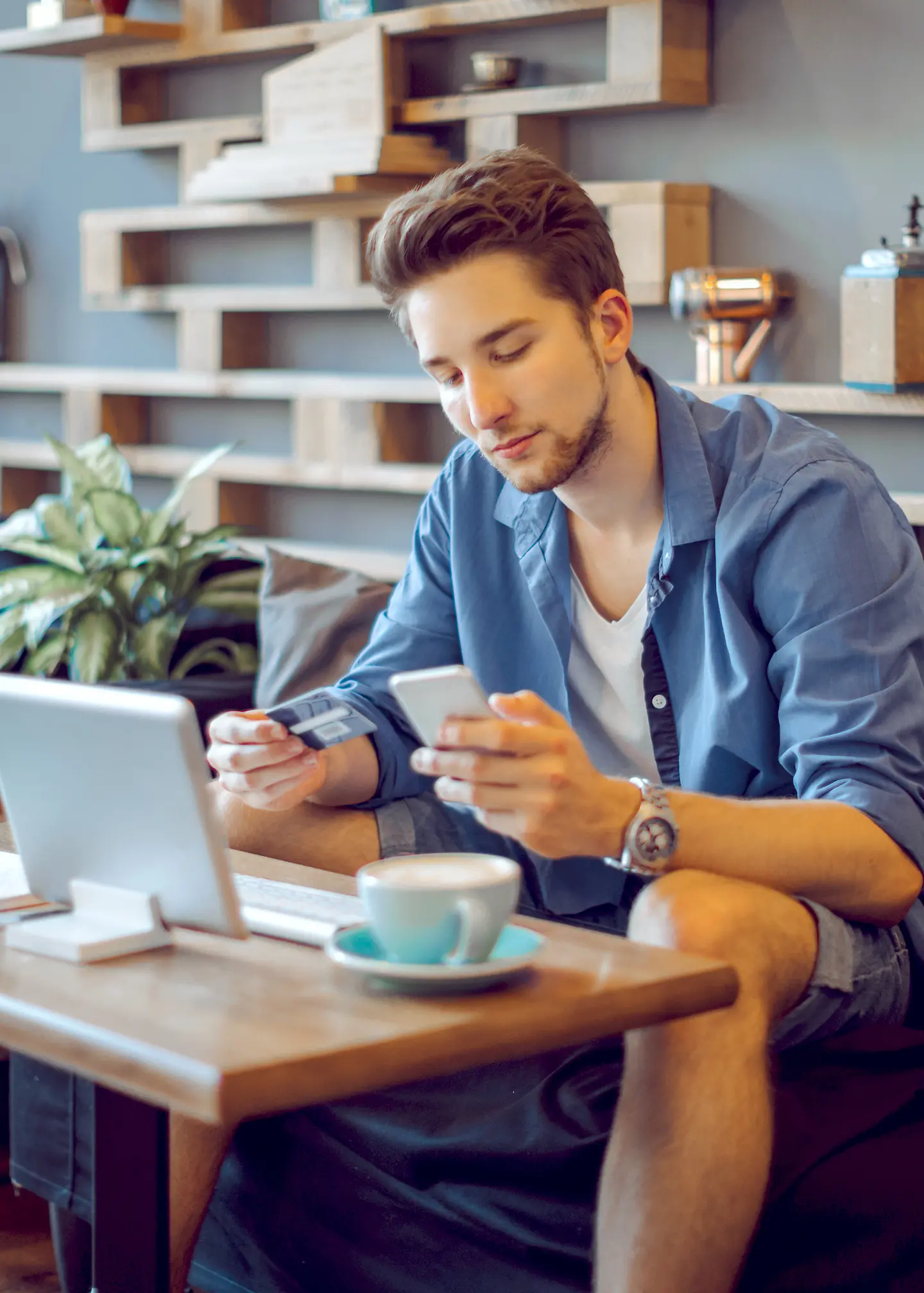 A young man at home with an Electronic Health Insurance Card