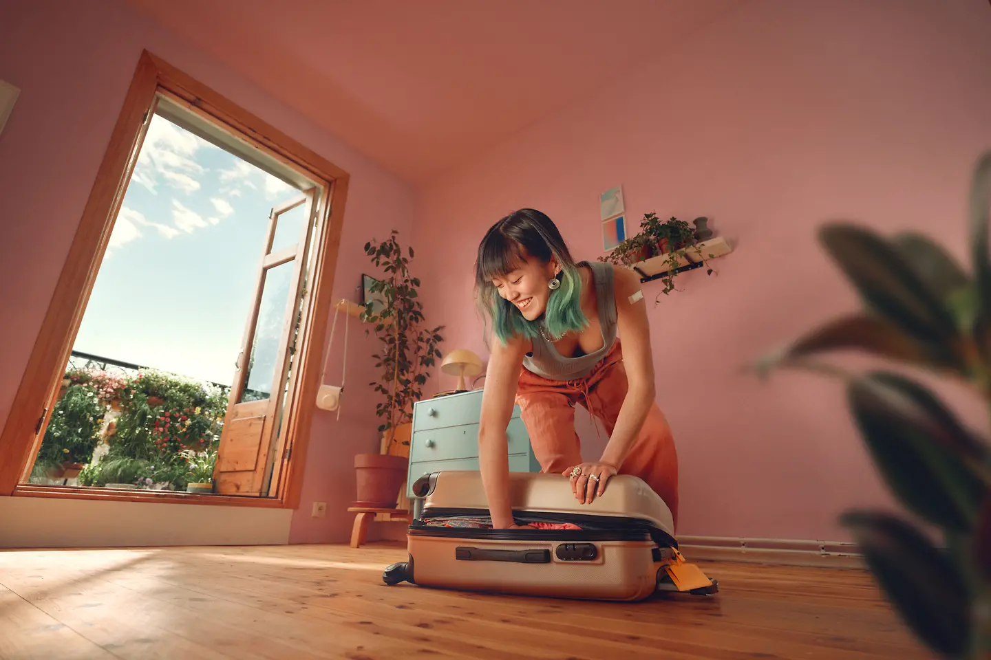 A woman packs her suitcase for the next trip.