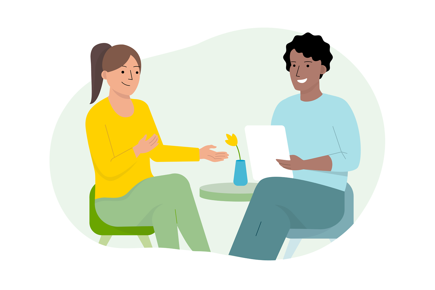 Eine Frau und ein Mannes im Gespräch am Tisch